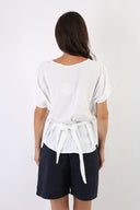 Blusa con fiocco sulla schiena