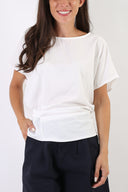 Blusa con fiocco sulla schiena