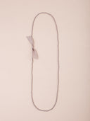 Collana lunga in cristalli con fiocco