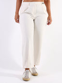 Pantalone baggy con pences e vita asimmetrica