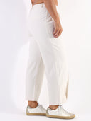 Pantalone baggy con pences e vita asimmetrica