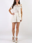 Blusa in macramé e cotone con fiocchetto sulla spalla