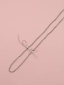 Collana lunga in cristalli con fiocchetto