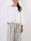 Blusa 2 layers con orlo paillettes