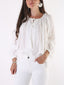 Camicetta con pizzo e nappe