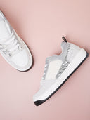 Sneakers bianche con dettagli glitter e zebrato