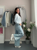 Jeans a palazzo con paillettes azzurre
