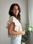 Top rosa con maniche volant