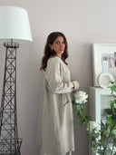 Cardigan lungo beige con tasche