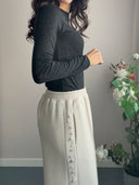 Pantalone beige con perle e strass
