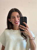 Blusa smanicata con scollo gioiello strass e perle